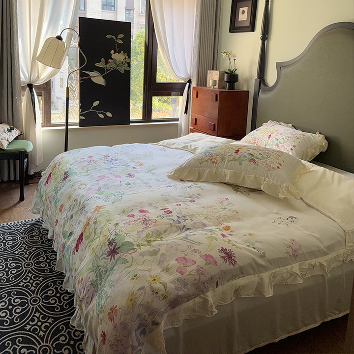 Cotton satin bed linen set with delicate watercolor botanical print and decorative ruffle