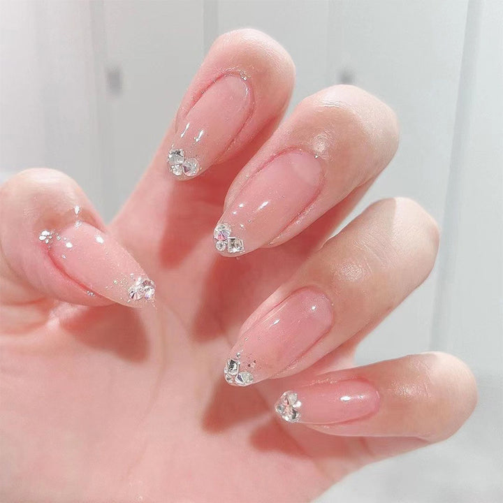 Elegant Nail Art with Glitter and Rhinestone Decorations Kalsten