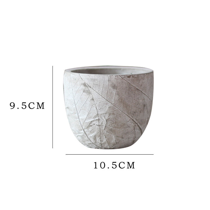 Decorative plant container made of handmade ceramic with leaf pattern Kalsten