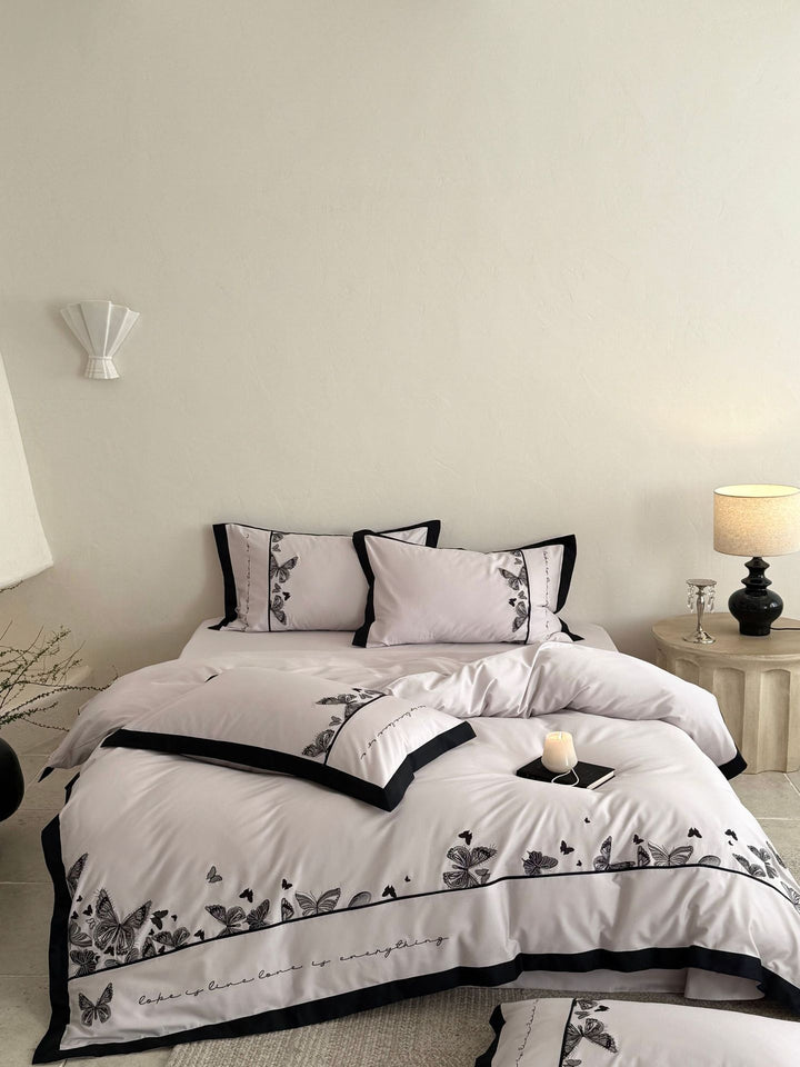 Luxurious cotton satin bedding set with butterfly embroidery and contrasting piping Kalsten