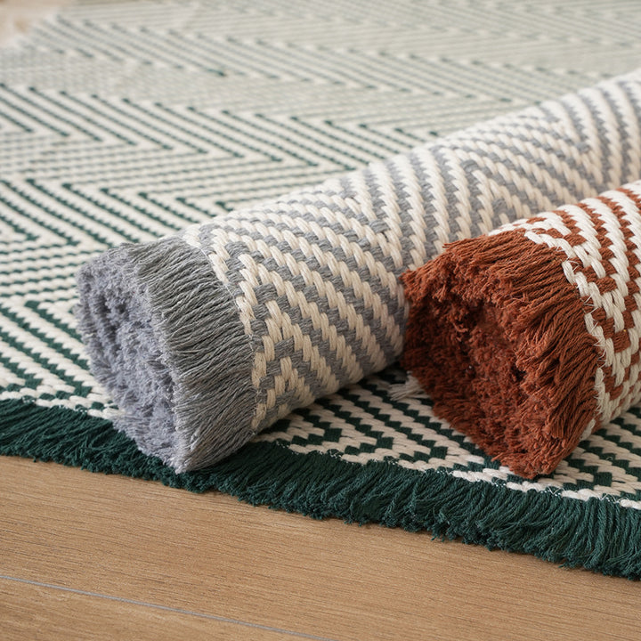 Handwoven cotton bath mat with herringbone pattern and fringes Kalsten