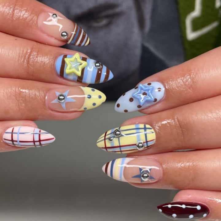 Decorative Stiletto Nail Art with Star Accents Kalsten