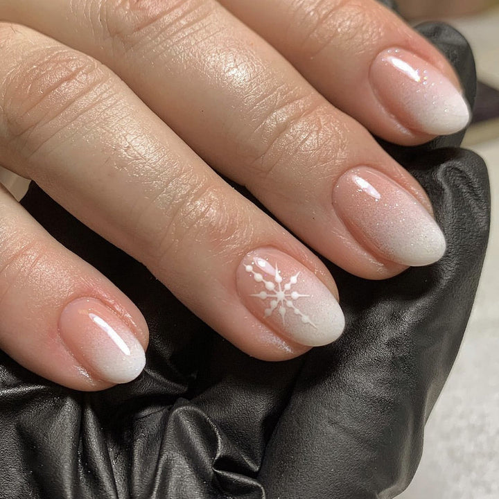 Artful Nail Extensions with Glitter and Snowflake Design Kalsten