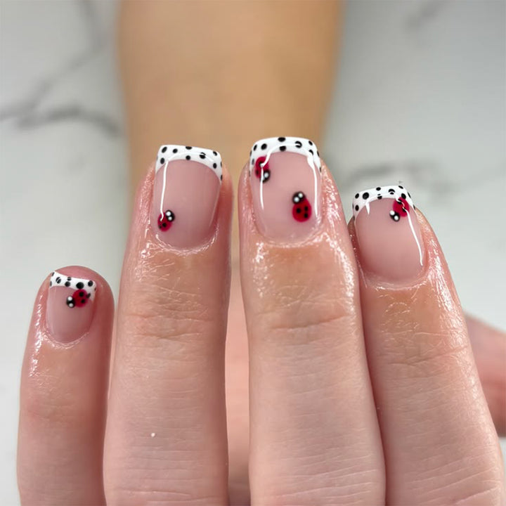 Artistic nail art with ladybug designs Kalsten