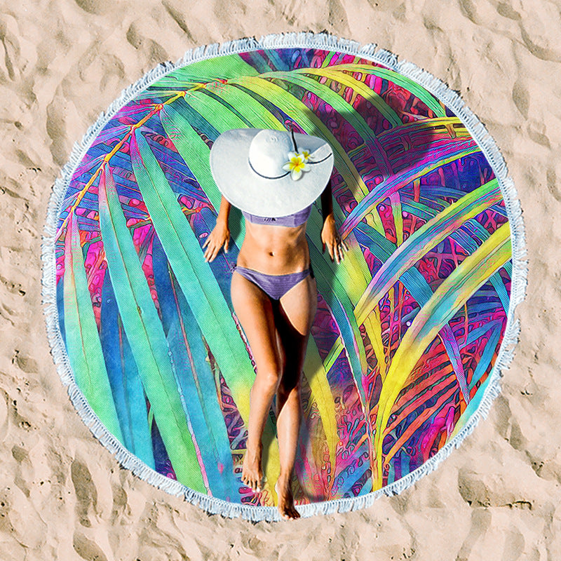 Round beach towel with tropical leaf print and fringe decoration Kalsten