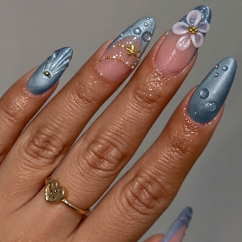 Creative acrylic nail set with elegant flower and glitter accents Kalsten