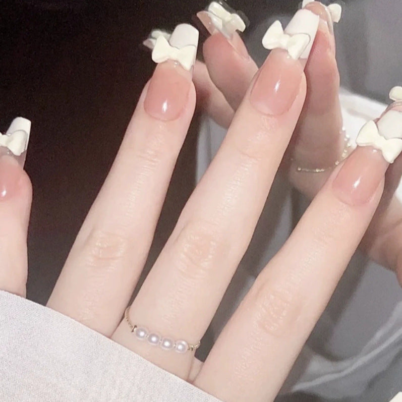 Elegant nail design with pearl embellishment Kalsten
