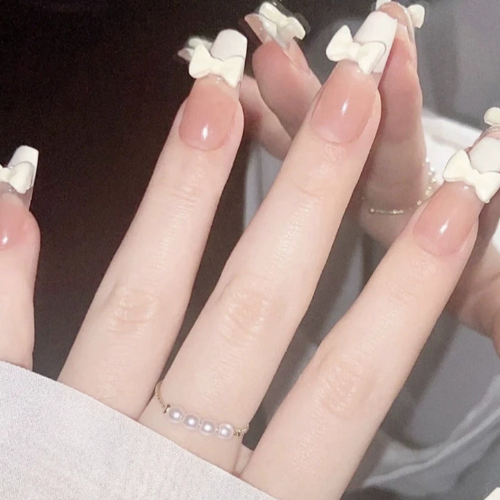 Elegant nail design with pearl embellishment Kalsten