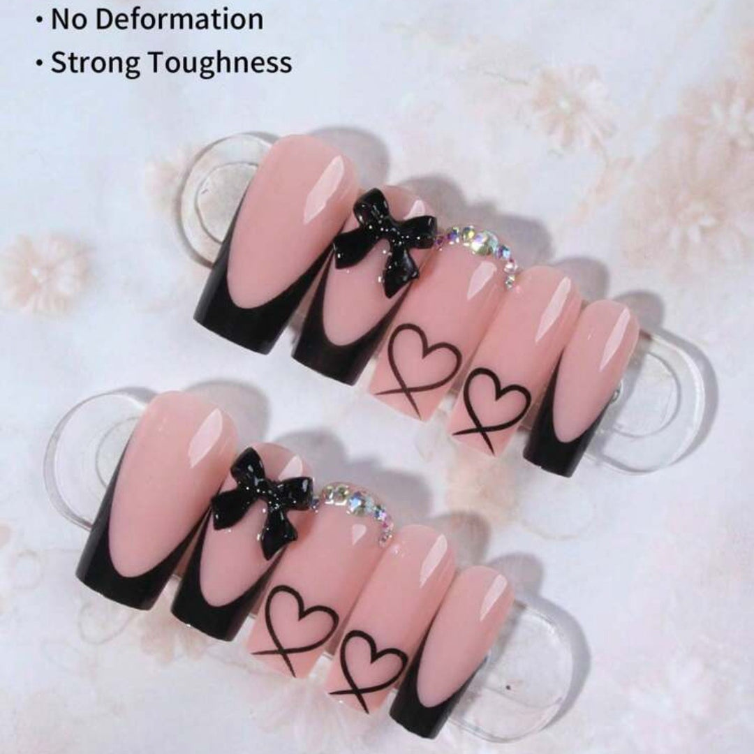 Acrylic nail set with elegant heart and bow design Kalsten