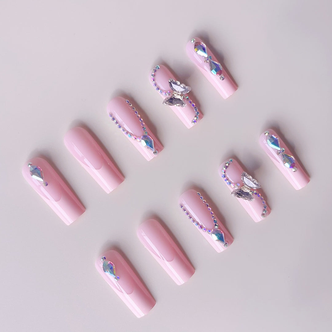 Acrylic nail set with elegant glitter and rhinestone accents Kalsten