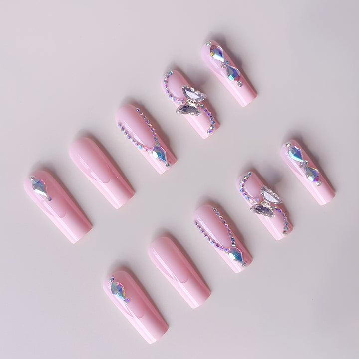 Acrylic nail set with elegant glitter and rhinestone accents Kalsten