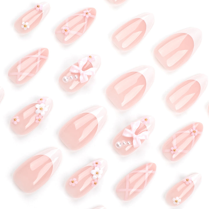 Artful nail art with delicate bows and floral accents Kalsten