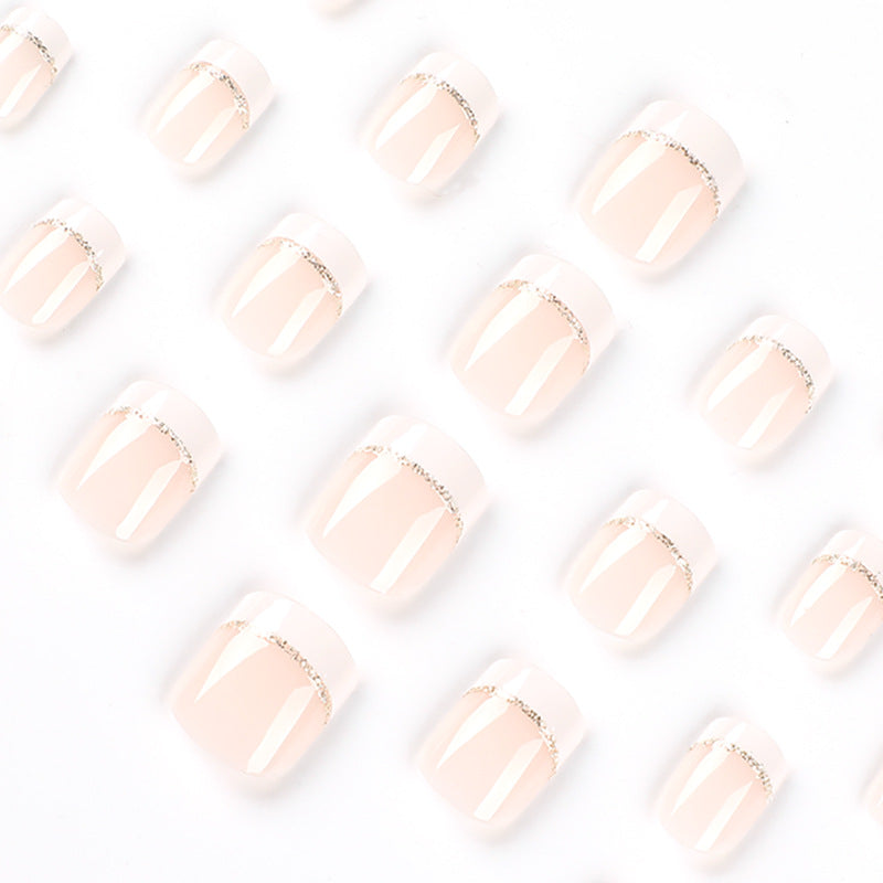Artful nail extensions with elegant French tip and gold accents Kalsten