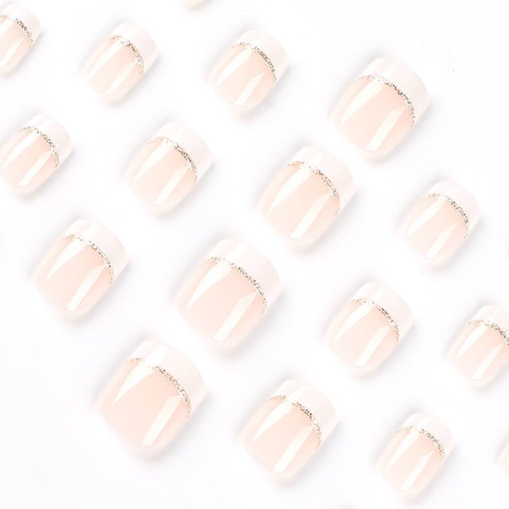 Artful nail extensions with elegant French tip and gold accents Kalsten
