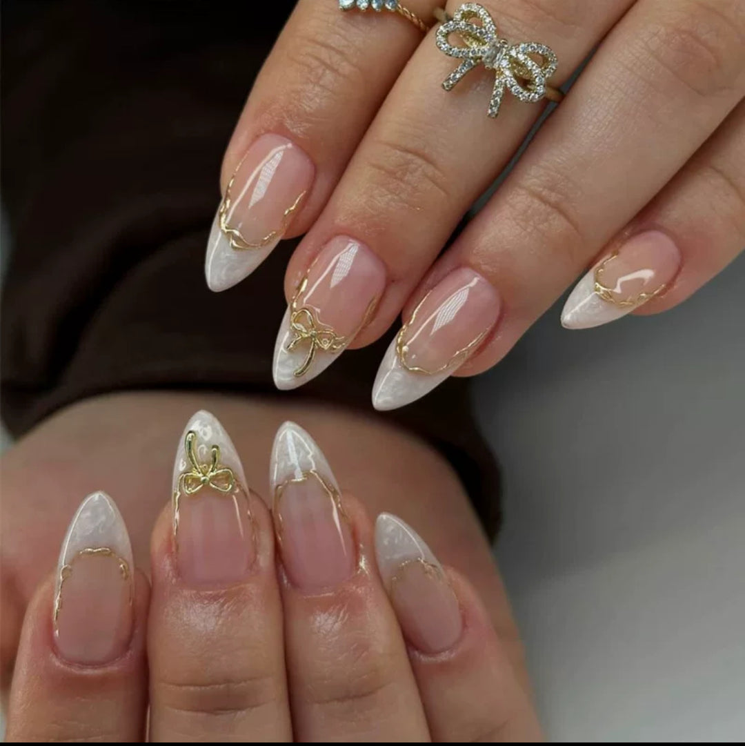 Artificial nails with elegant tip decorations and golden accents Kalsten