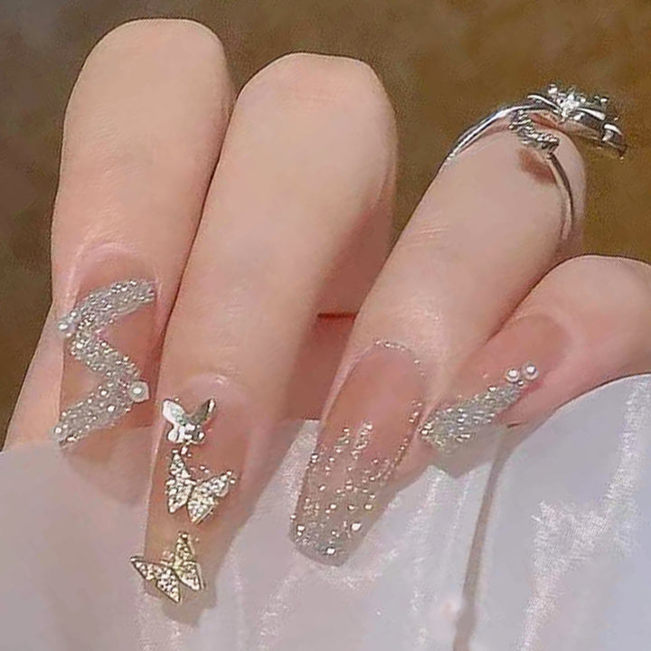 Artificial nails with sparkling rhinestone and bow accents Kalsten