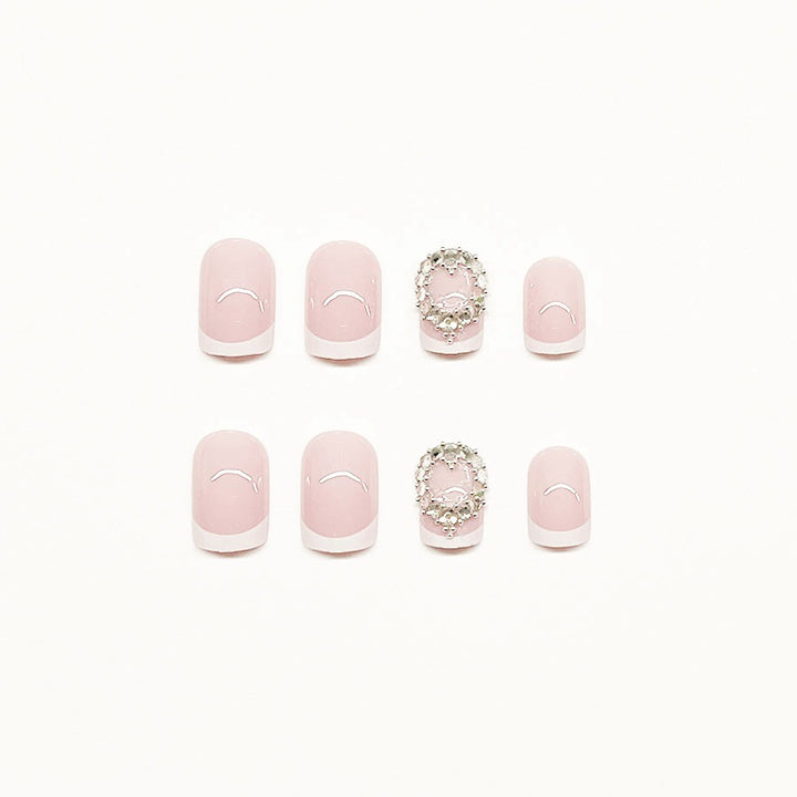 Artificial nail set with elegant French design and rhinestone embellishments Kalsten