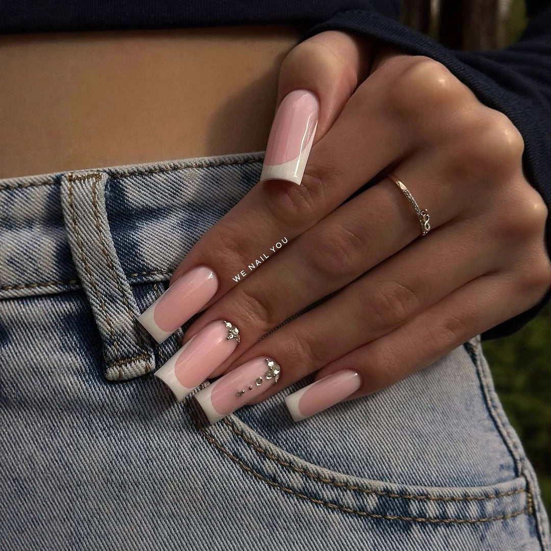 Acrylic nail set with elegant French tips and sparkling rhinestone accents Kalsten