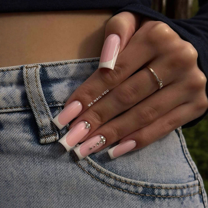 Acrylic nail set with elegant French tips and sparkling rhinestone accents Kalsten
