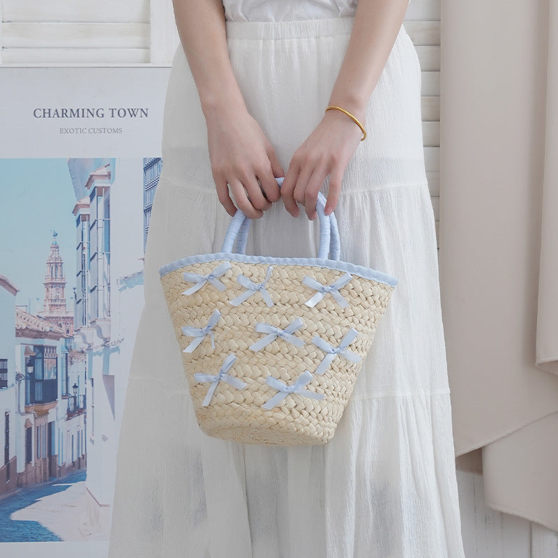 Basket bag with delicate bows and padded edge Kalsten