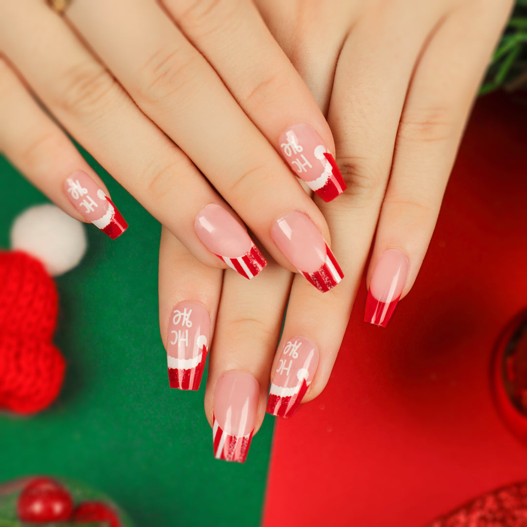 Artificial nail extensions in festive Christmas design Kalsten