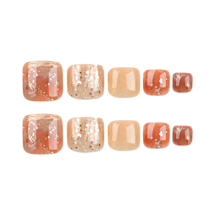 Artistic toenail design with glitter and golden accents Kalsten