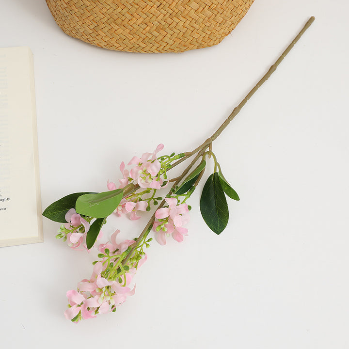 Artificial flower branch with bright flowers