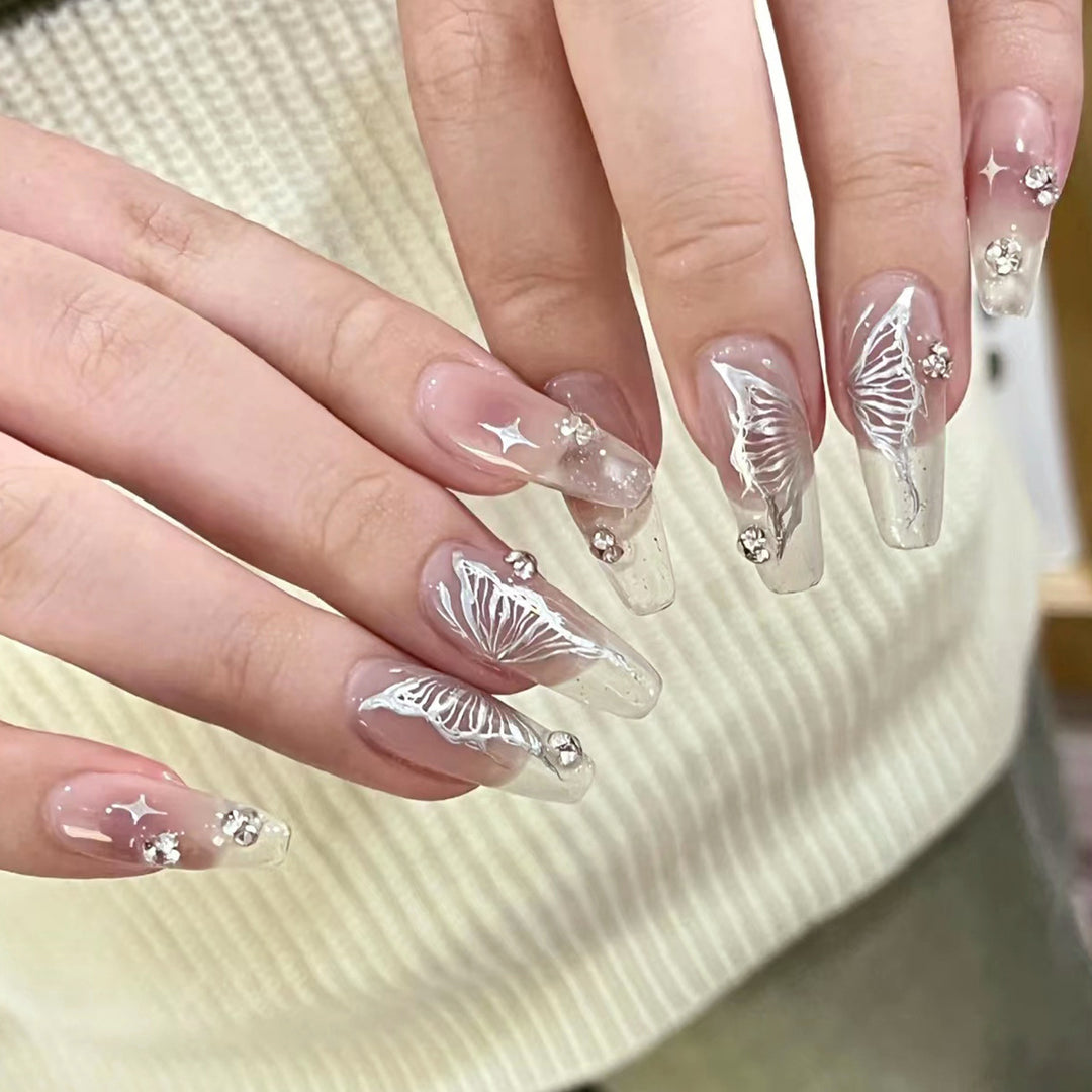 Elegant artificial nails with floral designs and glitter accents Kalsten