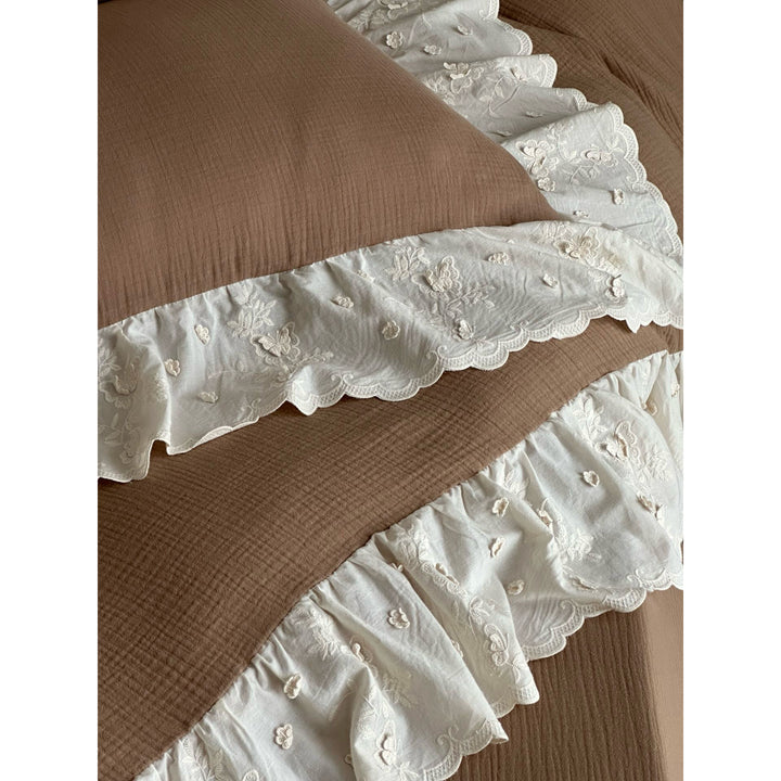Quilted cotton duvet with embroidered frill and layered ruffled bed skirt