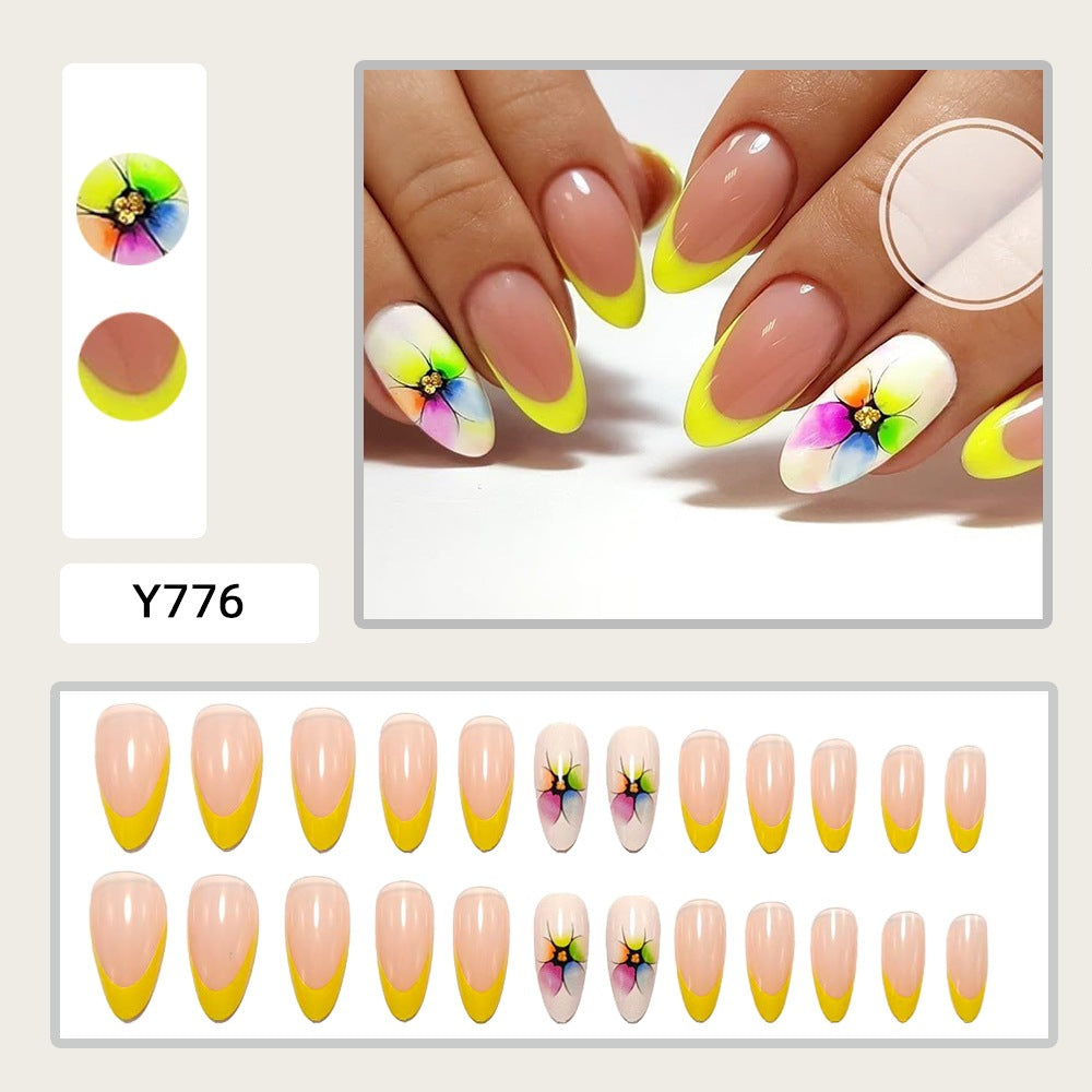 Artificial nails with colorful floral designs and striking color accents Kalsten