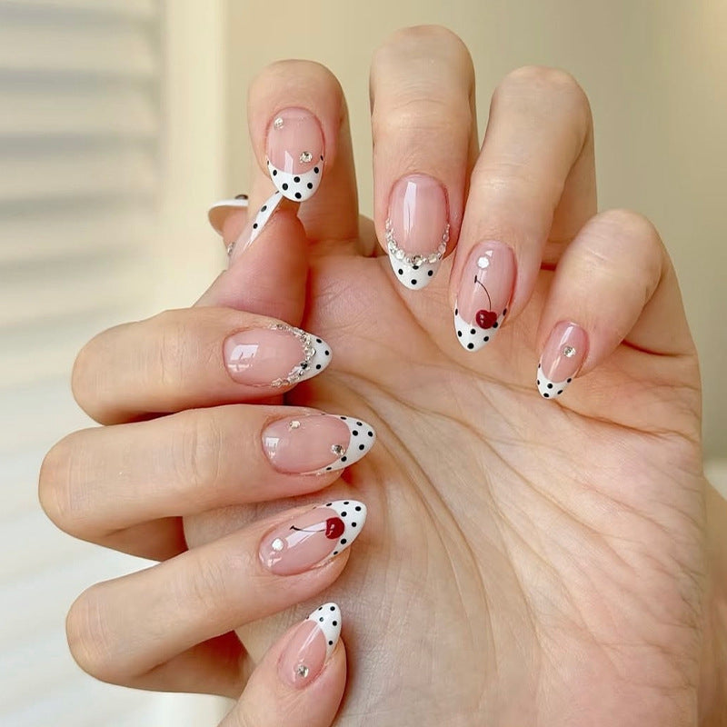 Acrylic nail set with polka-dotted accents and sparkling details Kalsten