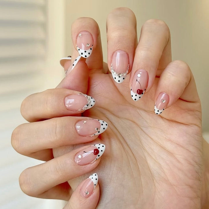 Acrylic nail set with polka-dotted accents and sparkling details Kalsten