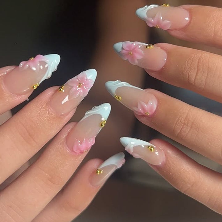Creative nail art set with delicate flower design and glitter accents Kalsten