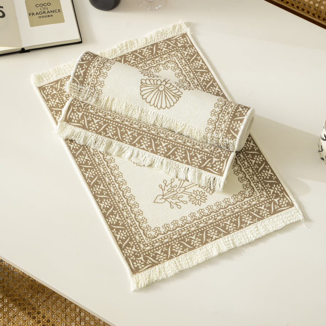 Round handmade woven decorative rug with fringes and botanical pattern Kalsten