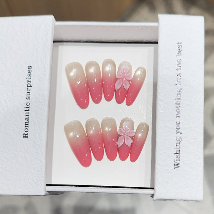 Artificial nails with romantic ombre design and floral accents Kalsten