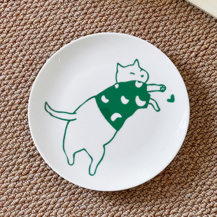 Handcrafted ceramic plate with illustrative cat design