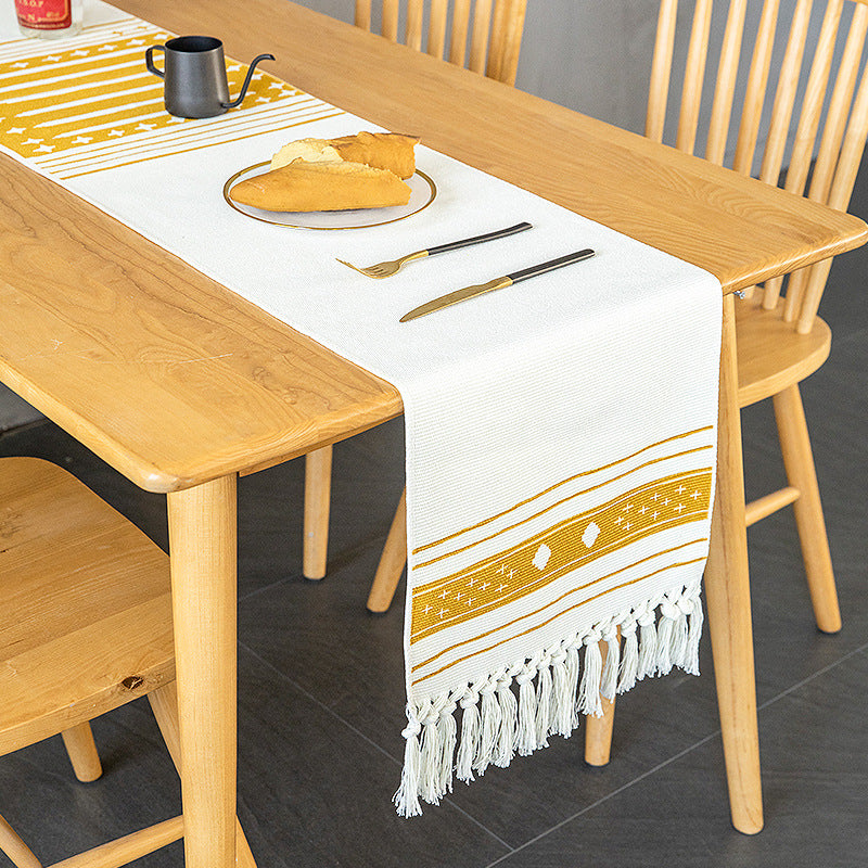 Woven Boho table runner made of cotton blend with decorative fringes and graphic stripe pattern Kalsten