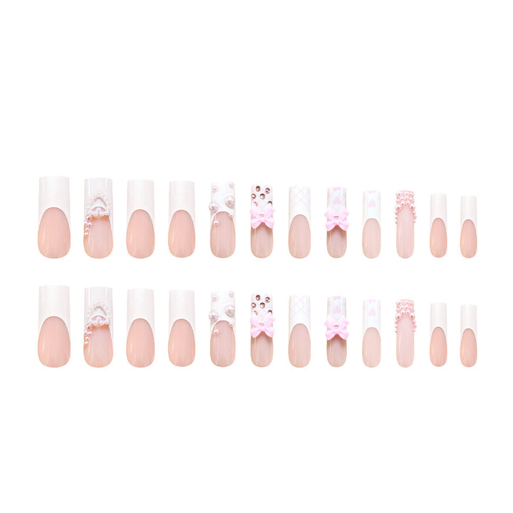 Artistic acrylic nails with bow and pearl decorations Kalsten