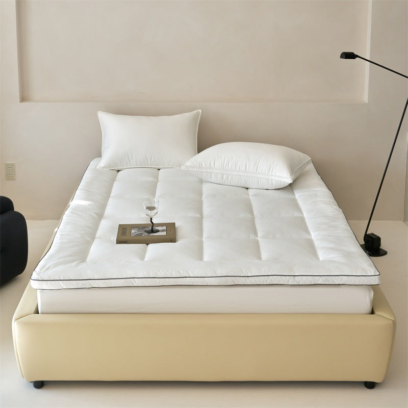 Padded mattress topper made of quilted microfiber and cotton comfort