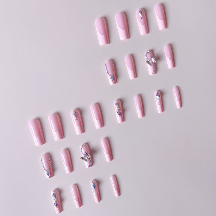 Acrylic nail set with elegant glitter and rhinestone accents Kalsten