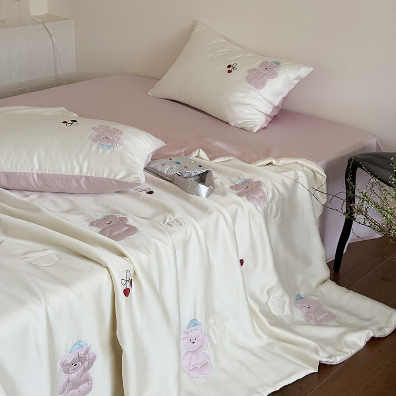 Satin bedding set with playful whale print and silky shiny surface
