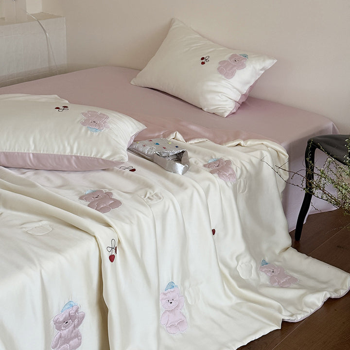 Satin bedding set with playful whale print and silky shiny surface