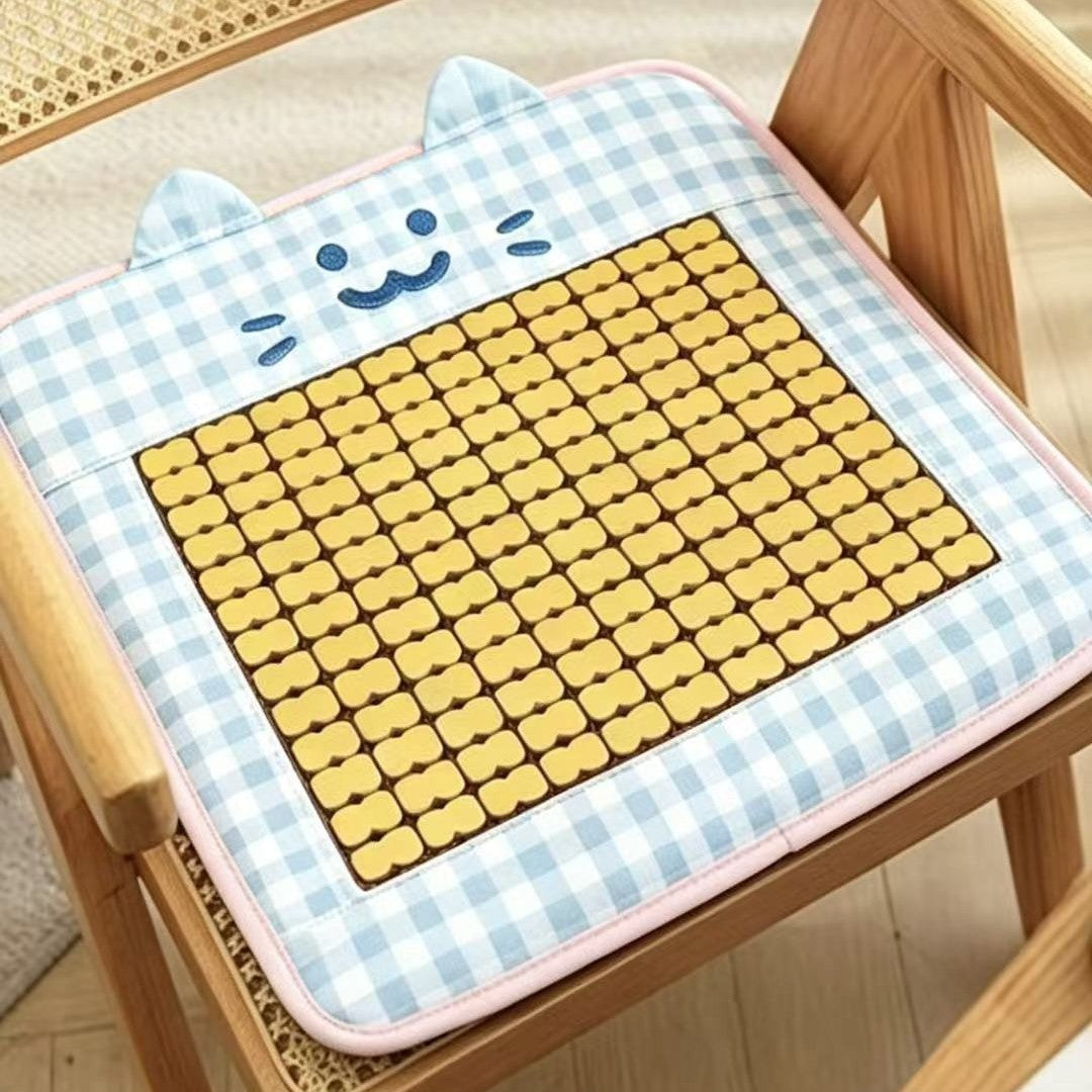 Padded seat cushion with massage stones and cat appliqué