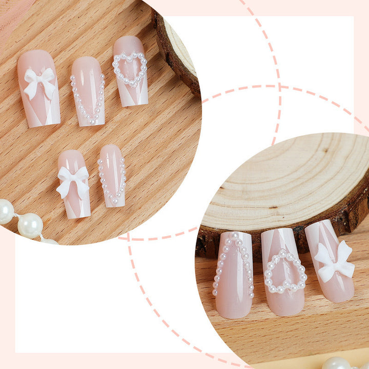 Artificial nail set with filigree hearts and bow decorations Kalsten