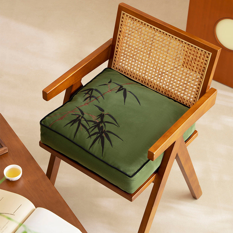 Extra-thick chair cushion with embroidered bamboo design and removable cover