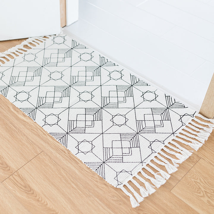 Flat-woven entrance runner made of cotton blend with geometric tile pattern and fringes Kalsten