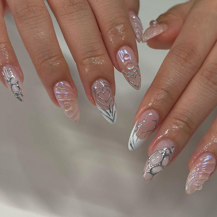 Artistic stiletto nails with holographic effects Kalsten