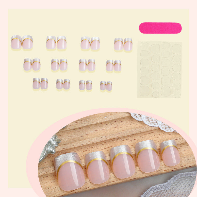 Artificial nail creations with elegant gold trim Kalsten