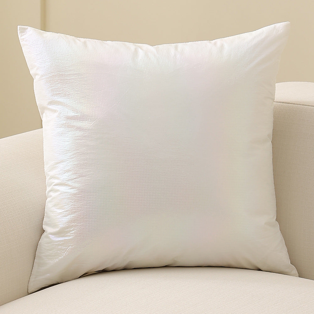 Square decorative cushion with delicate mother-of-pearl look and fine micro tuft structure