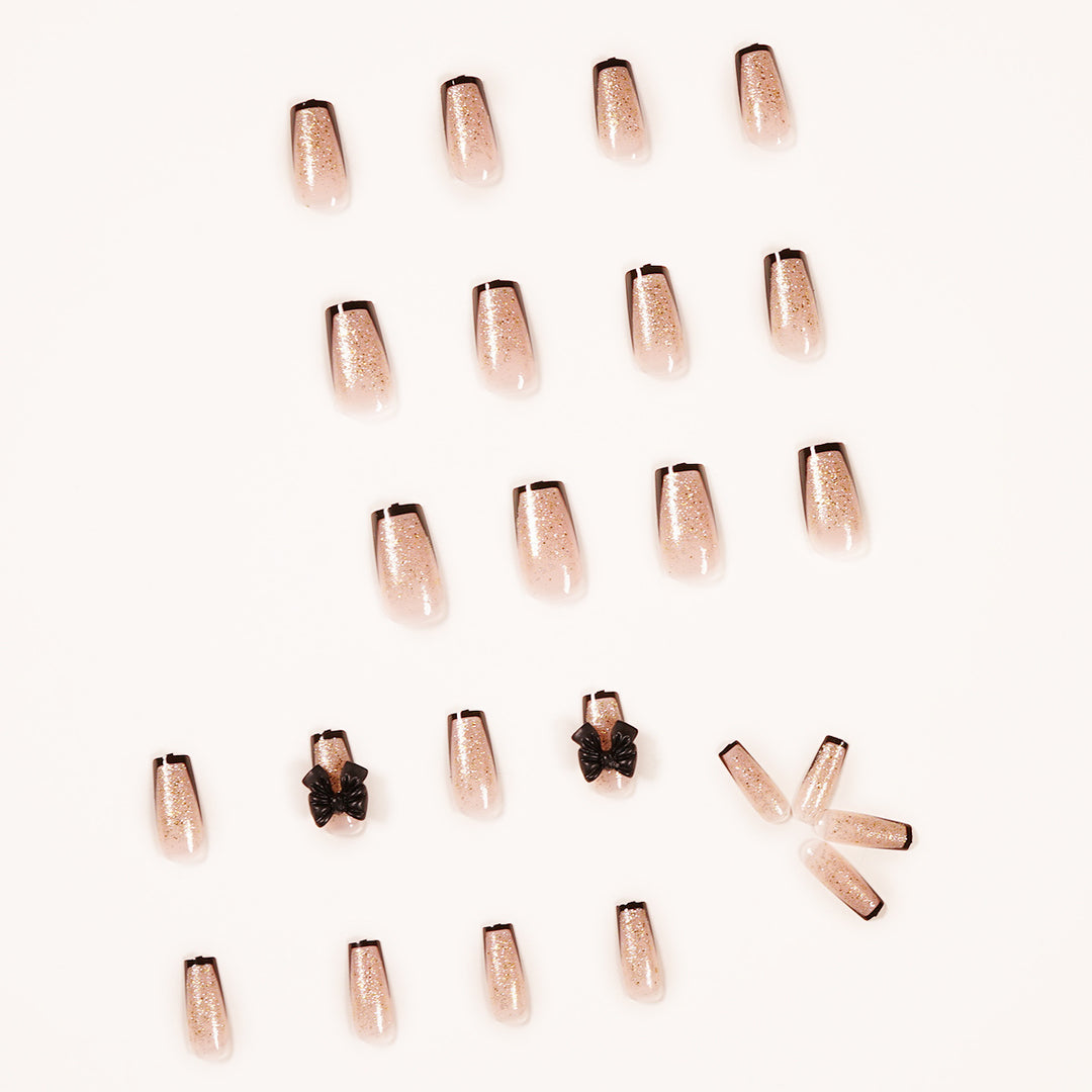 Artistic Nail Extensions with Glitter and Bow Accents Kalsten